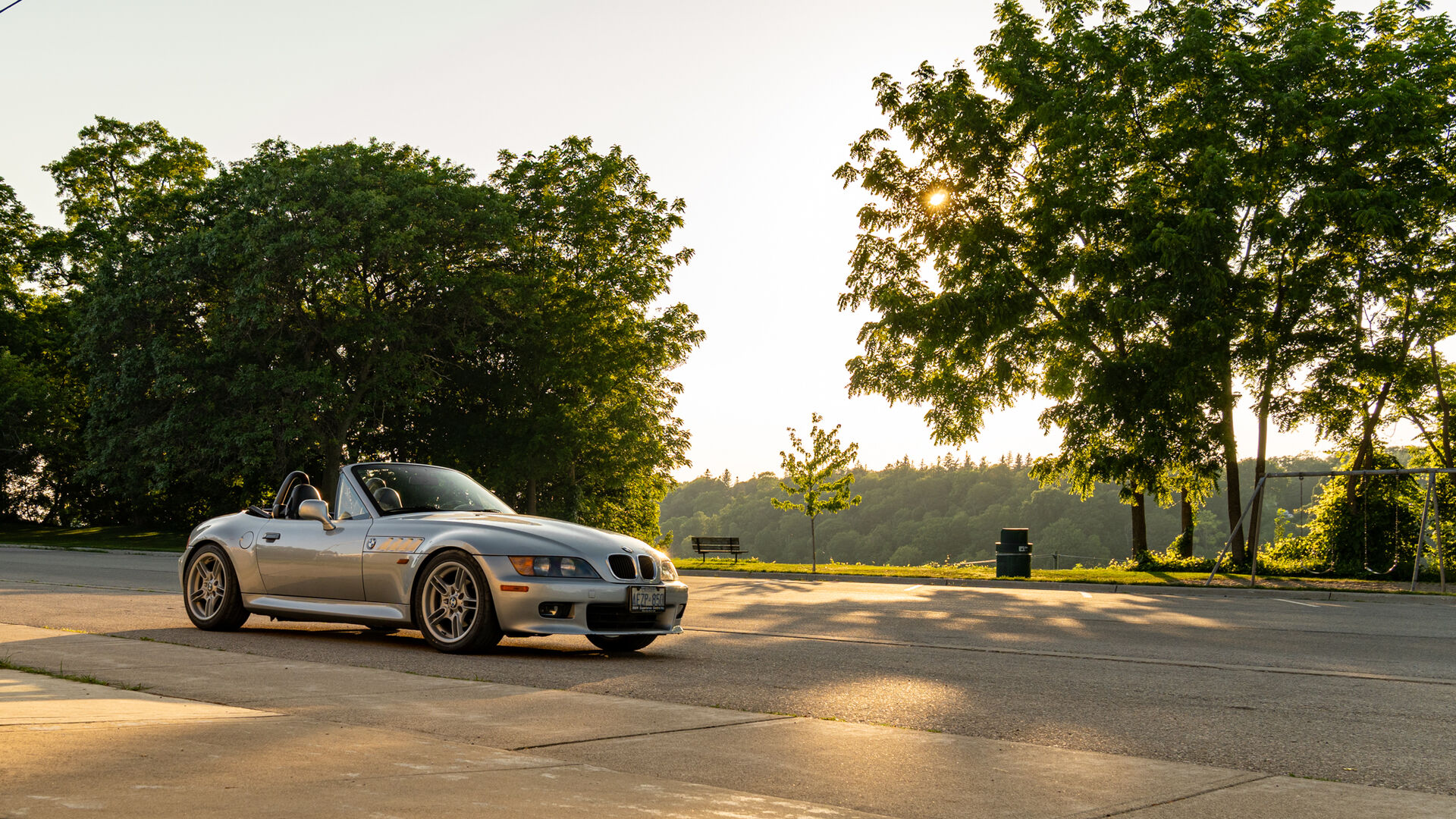 The Z3 in a Goderich park overlooking the treeline at golden hour